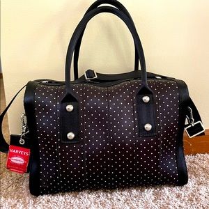 Harveys seatbelt bag. Black with white polka dots.